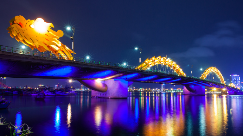 Da Nang Sightseeing: An In-Depth Guide with AFS Travel 2 Da Nang Sightseeing – panoramic view of Dragon Bridge at night over Han