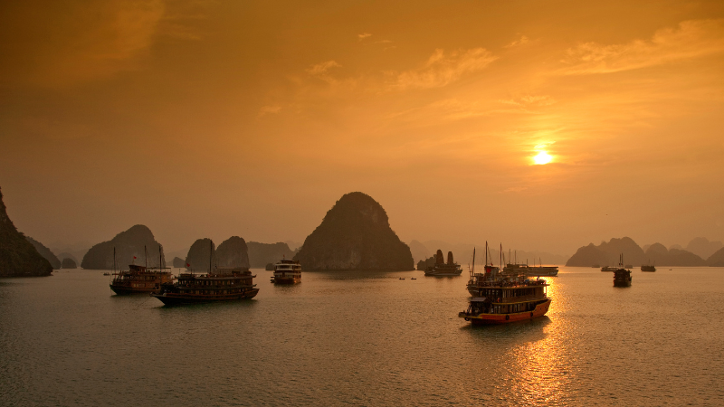 Halong Bay Cruise Overnight: A Timeless Journey Through Vietnam’s Iconic Seascape 2 Sunset view over limestone islands during a Halong Bay cruise overnight