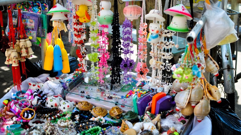 Stone bracelets and carved statues sold as Nha Trang souvenirs